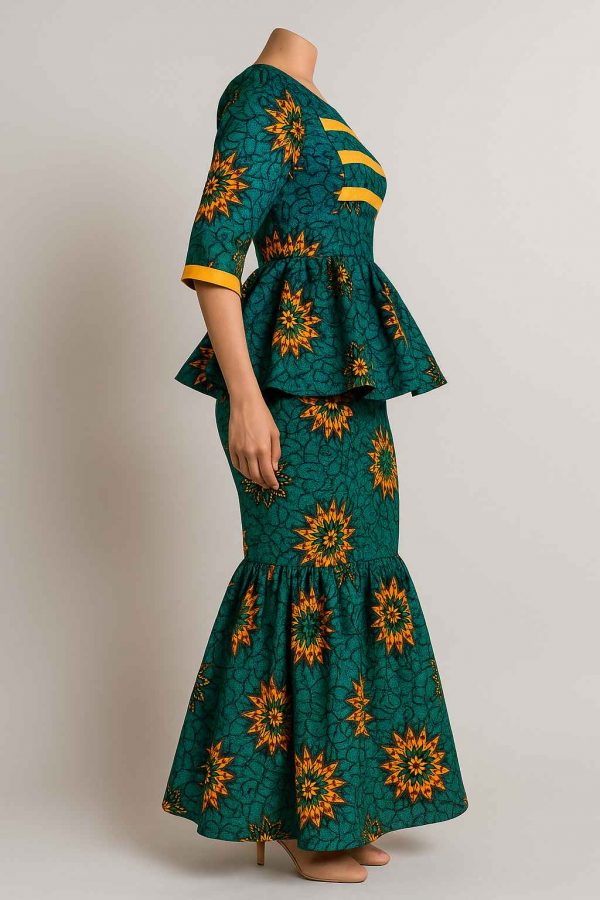 Side view of a women’s African one-step peplum dress with structured bodice, peplum waist, and mermaid skirt in green and orange print