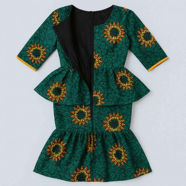 Interior view of an African one-step peplum dress showing clean seams, stitched lining, and reinforcement beneath the peplum and skirt