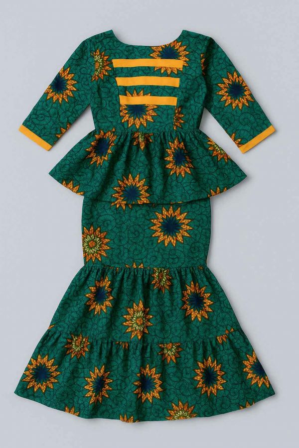 Top-down view of a one-step African peplum dress laid flat to reveal structured bodice, peplum waist, and flared skirt