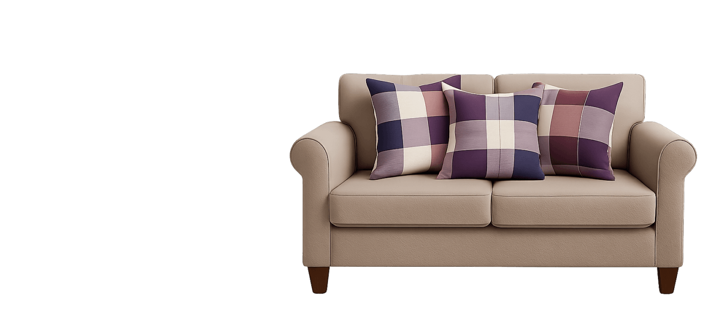 Three plaid throw pillows in purple, burgundy, and beige arranged neatly on a full beige sofa — showcasing Jackie Tailor's premium cushion design in a lifestyle setting