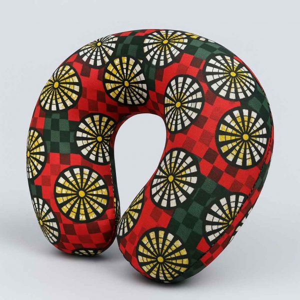 Studio image of African wax print U-shaped neck pillow taken at a slight angle to show depth and form