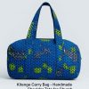 Handmade kitenge carry bag, front view, blue geometric pattern