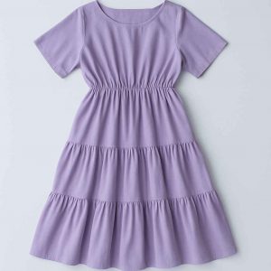 Top-down flat-lay view of a lavender women’s midi dress with two gathered tiers, modest neckline, and short sleeves