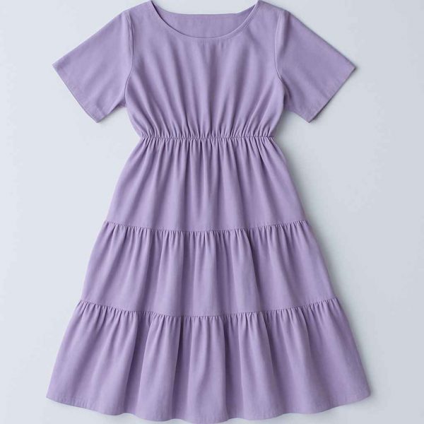 Top-down flat-lay view of a lavender women’s midi dress with two gathered tiers, modest neckline, and short sleeves